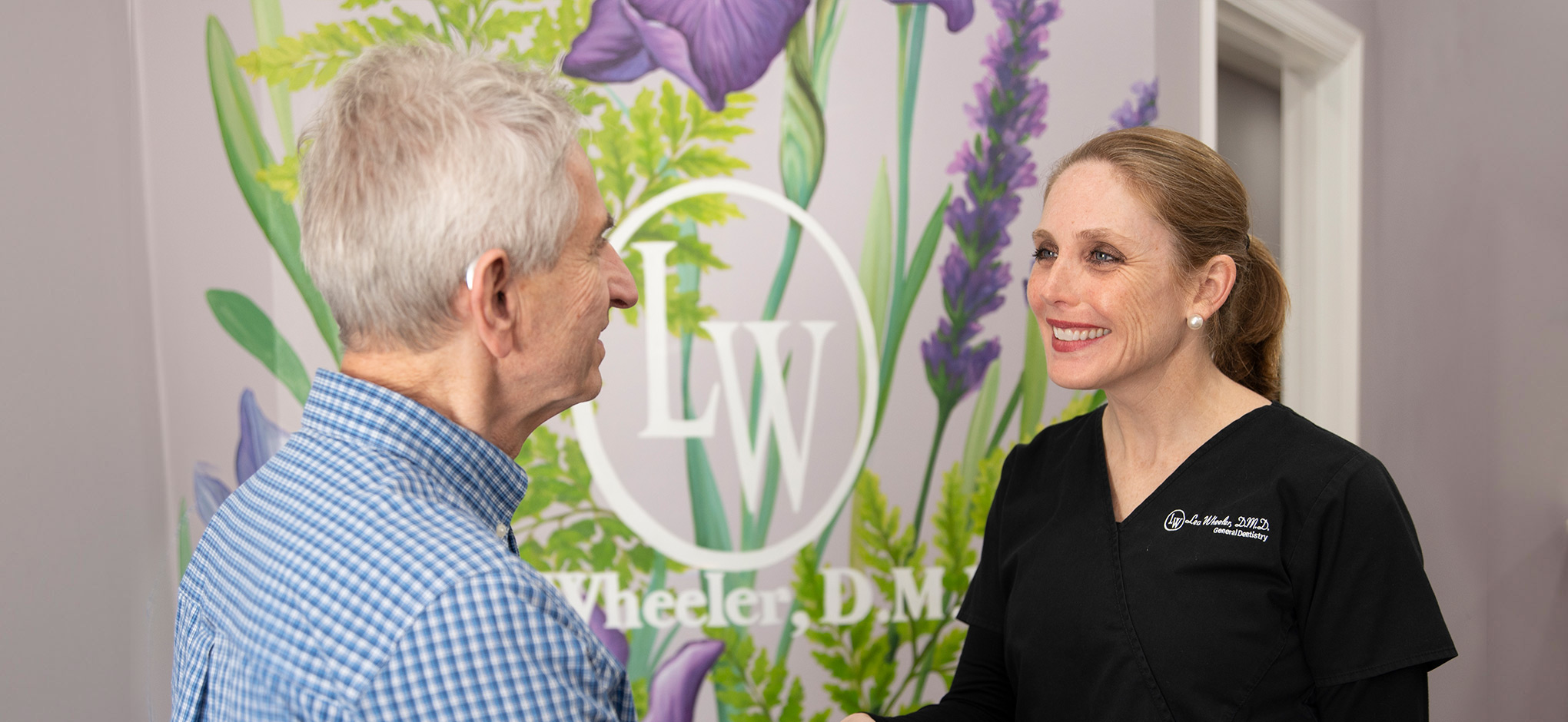 Dr. Wheeler greeting a patient